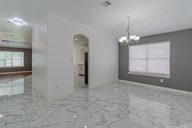 empty room with an inviting chandelier, marble finish floor, visible vents, baseboards, and arched walkways