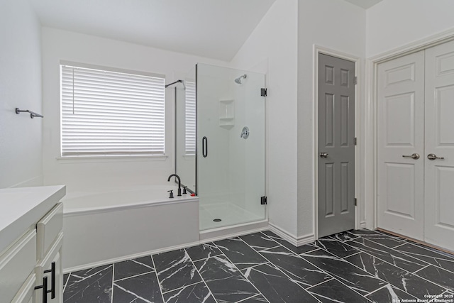 full bath featuring a stall shower, vanity, a bath, and marble finish floor