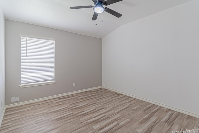 unfurnished room featuring a ceiling fan, baseboards, lofted ceiling, and light wood-type flooring