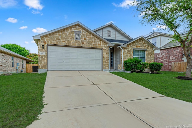 ranch-style home featuring fence, a front lawn, concrete driveway, and stone siding