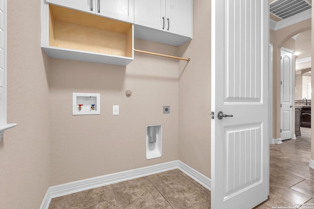 laundry area with hookup for a washing machine, electric dryer hookup, gas dryer hookup, baseboards, and visible vents