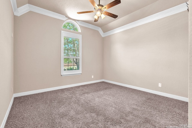 spare room featuring crown molding, carpet flooring, ceiling fan, and baseboards