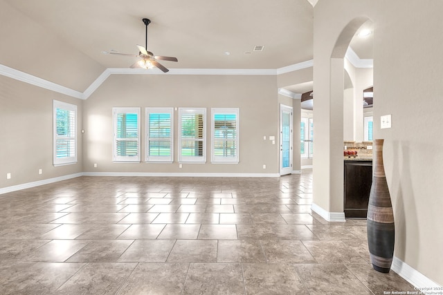 unfurnished living room featuring crown molding, a ceiling fan, visible vents, baseboards, and lofted ceiling