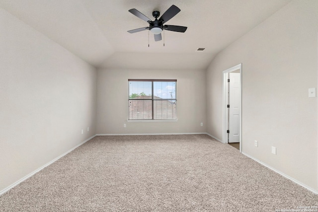 unfurnished room featuring baseboards, a ceiling fan, carpet, and vaulted ceiling