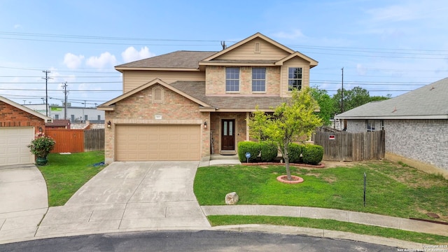 view of front facade with brick siding, fence, driveway, and a front lawn
