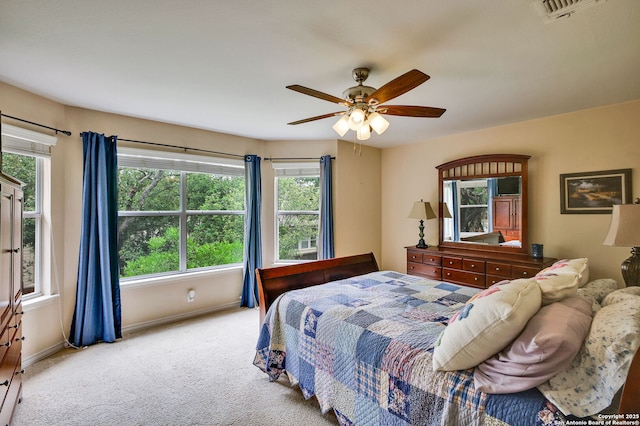 bedroom with baseboards, carpet, ceiling fan, and visible vents