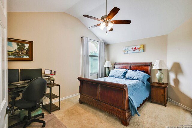 bedroom with baseboards, vaulted ceiling, light carpet, and ceiling fan