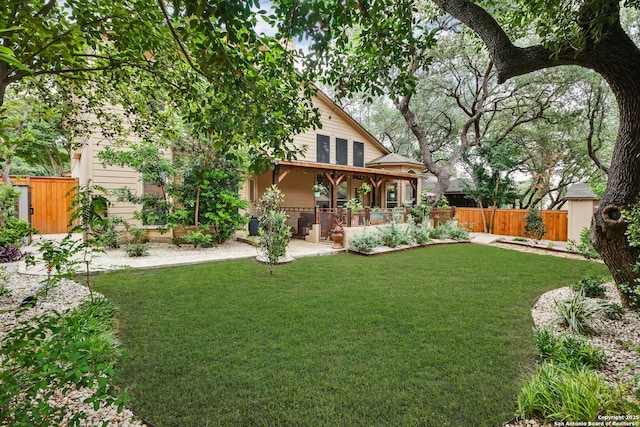 view of yard with fence and a patio area