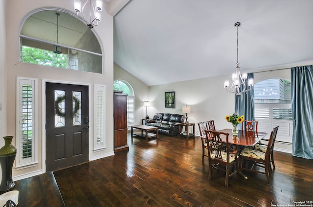 dining area featuring wood-type flooring, an inviting chandelier, and a healthy amount of sunlight
