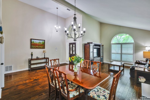 dining area featuring an inviting chandelier, high vaulted ceiling, hardwood / wood-style flooring, and visible vents