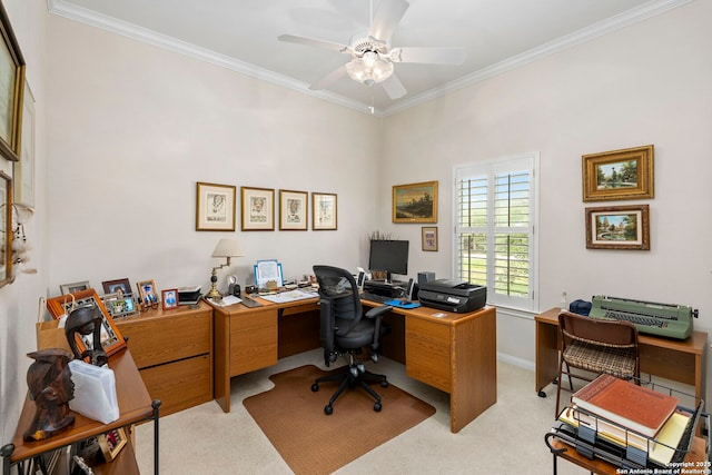 carpeted office featuring ceiling fan, crown molding, and baseboards