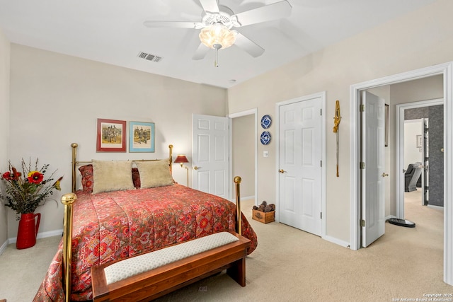 bedroom featuring visible vents, ceiling fan, light colored carpet, and baseboards