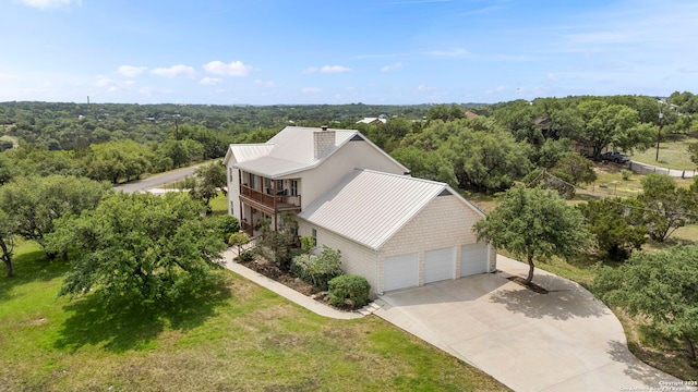 drone / aerial view featuring a view of trees