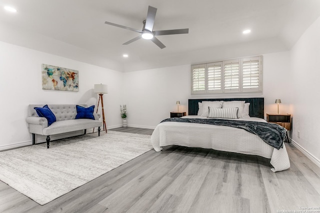 bedroom featuring recessed lighting, ceiling fan, wood finished floors, and baseboards