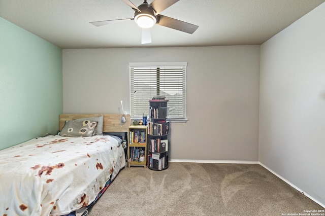 bedroom featuring a ceiling fan, carpet floors, and baseboards