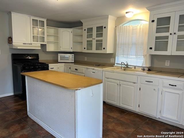 116 N Matlock, Poth, TX 78147 - kitchen featuring a sink, white appliances, white cabinets, and under cabinet range hood