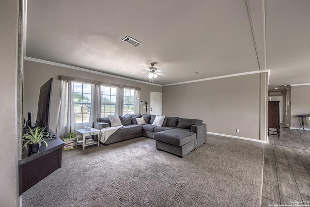 living area with crown molding, visible vents, ceiling fan, and baseboards