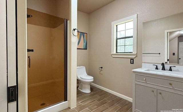 7274 Fm 327, Elmendorf, TX 78112 - bathroom featuring a shower stall, vanity, wood tiled floor, toilet, and baseboards