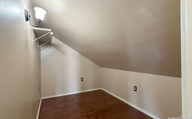 7274 Fm 327, Elmendorf, TX 78112 - additional living space featuring dark wood finished floors, baseboards, and lofted ceiling