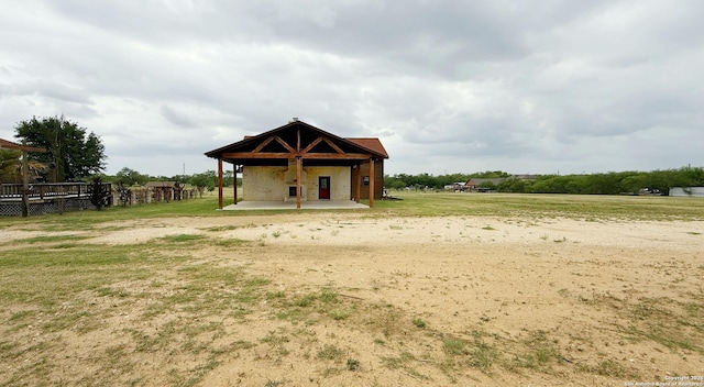 7274 Fm 327, Elmendorf, TX 78112 - exterior space featuring a patio and a lawn