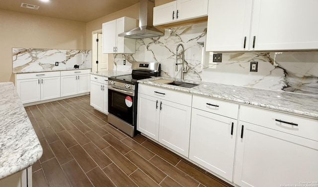 7274 Fm 327, Elmendorf, TX 78112 - kitchen with a sink, stainless steel electric range oven, tasteful backsplash, visible vents, and wall chimney range hood
