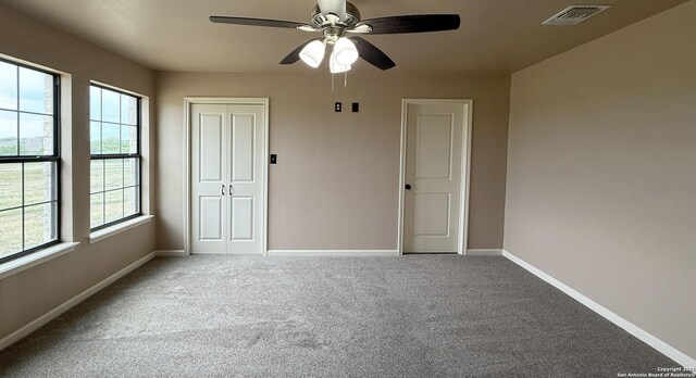 7274 Fm 327, Elmendorf, TX 78112 - carpeted empty room featuring visible vents, a ceiling fan, and baseboards