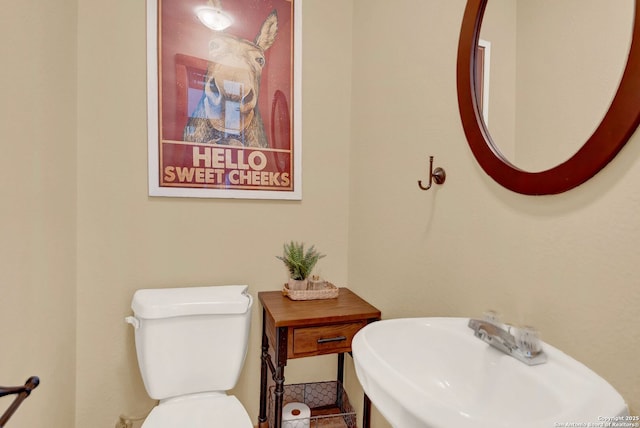 bathroom featuring toilet and a sink