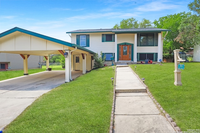 split foyer home with a front lawn, driveway, and an attached carport