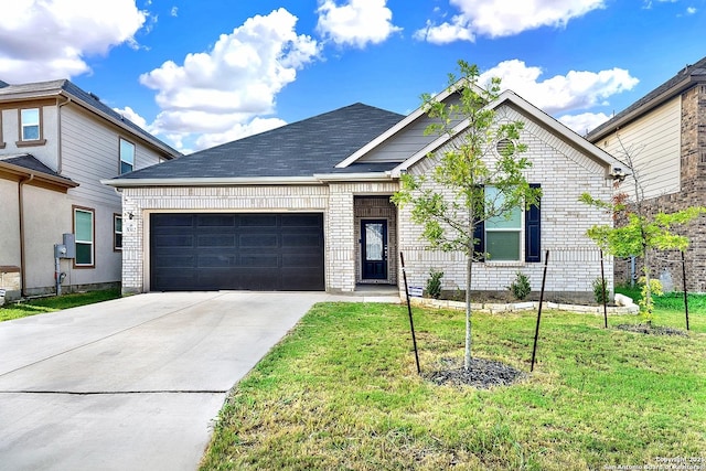 view of front of house featuring concrete driveway, a front lawn, an attached garage, and brick siding
