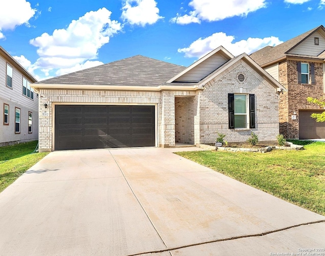 view of front facade featuring a garage, brick siding, a front lawn, and driveway