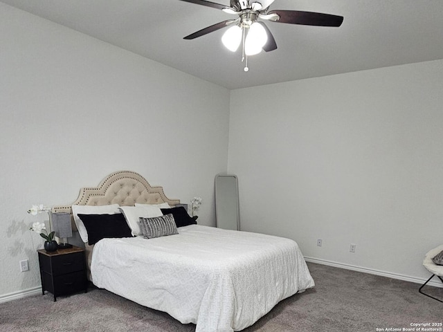 carpeted bedroom with ceiling fan and baseboards