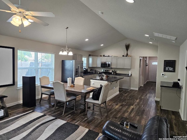 943 Patton, San Antonio, TX 78237 - dining room featuring lofted ceiling, visible vents, plenty of natural light, and dark wood finished floors