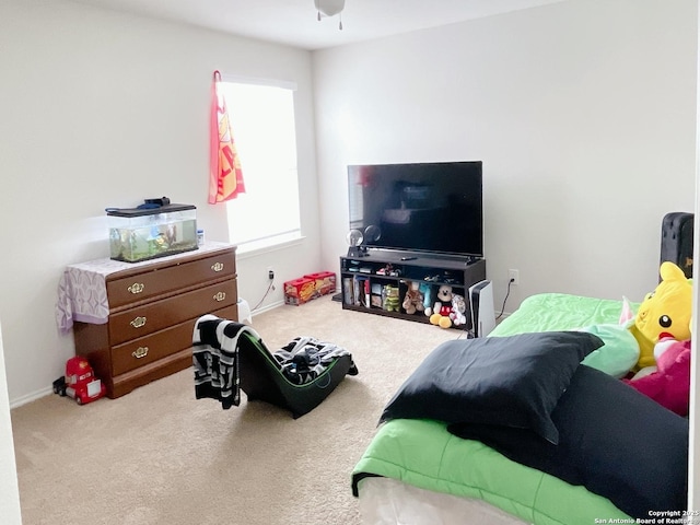 bedroom with baseboards and carpet floors