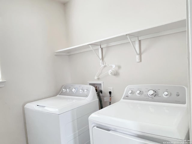 laundry area with separate washer and dryer and laundry area