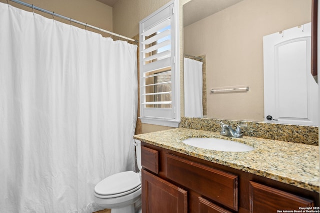 full bathroom featuring toilet and vanity