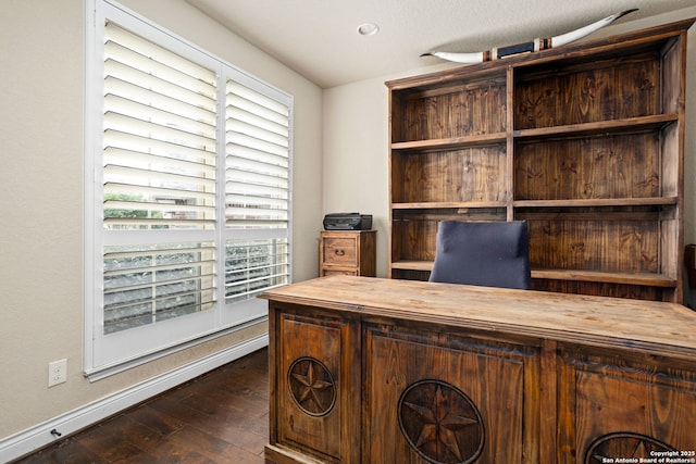 office area featuring baseboards and wood-type flooring