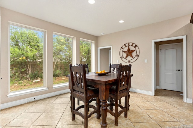 dining room with light tile patterned floors, recessed lighting, and baseboards