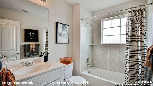 full bath with toilet, visible vents, shower / bathtub combination with curtain, and vanity