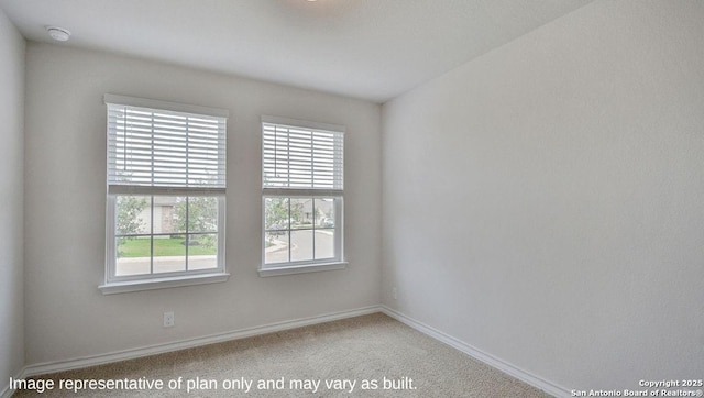 unfurnished room featuring baseboards and carpet floors