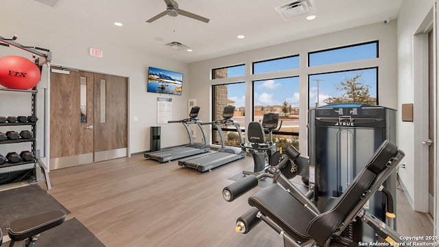 exercise room with wood finished floors, visible vents, ceiling fan, and recessed lighting