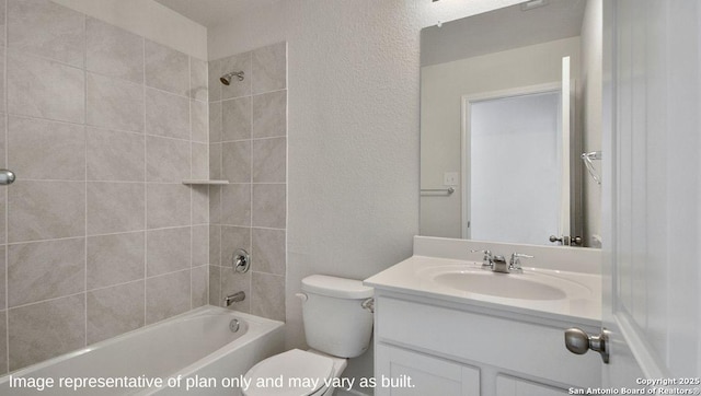 bathroom with washtub / shower combination, toilet, a textured wall, and vanity