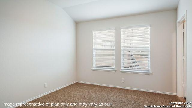 5055 Wichita Pike, San Antonio, TX 78253 - empty room featuring baseboards, lofted ceiling, and carpet flooring