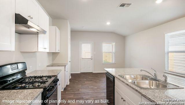 5055 Wichita Pike, San Antonio, TX 78253 - kitchen with white cabinetry, a sink, under cabinet range hood, black appliances, and dark wood finished floors