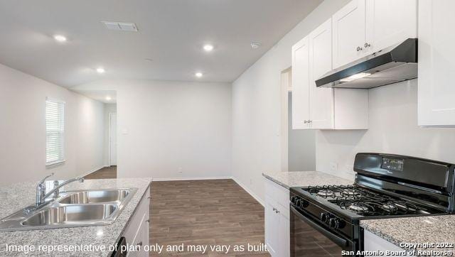 5055 Wichita Pike, San Antonio, TX 78253 - kitchen featuring recessed lighting, under cabinet range hood, white cabinets, a sink, and black range with gas stovetop