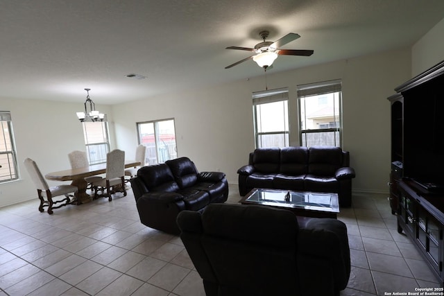 4326 Safe Hbr, San Antonio, TX 78244 - living area featuring baseboards, tile patterned flooring, ceiling fan with notable chandelier, and visible vents