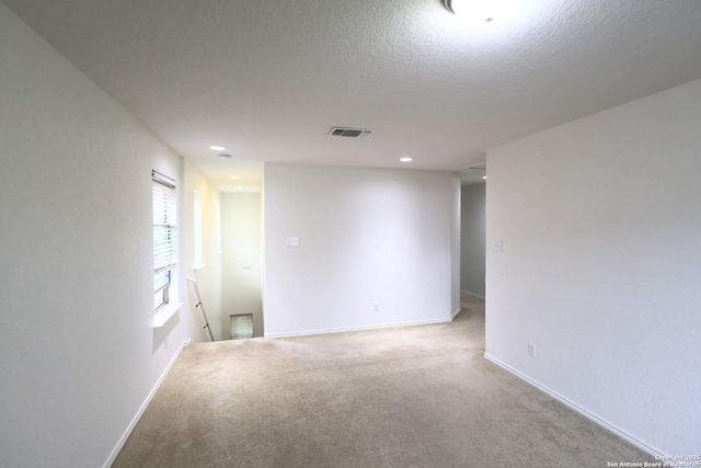 4326 Safe Hbr, San Antonio, TX 78244 - carpeted spare room with visible vents, recessed lighting, a textured ceiling, and baseboards