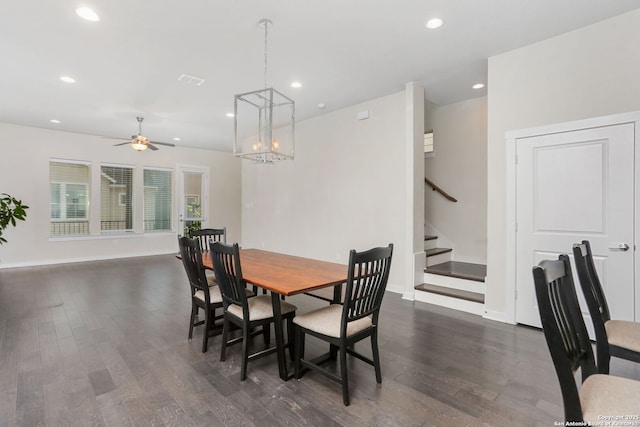 dining area with recessed lighting, dark wood-style flooring, stairs, baseboards, and ceiling fan with notable chandelier