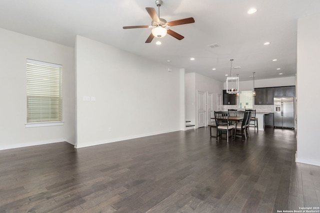 living room with visible vents, dark wood-style floors, baseboards, recessed lighting, and a ceiling fan