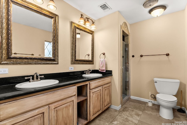 114 Nueces, Seguin, TX 78155 - bathroom with toilet, a sink, baseboards, and visible vents