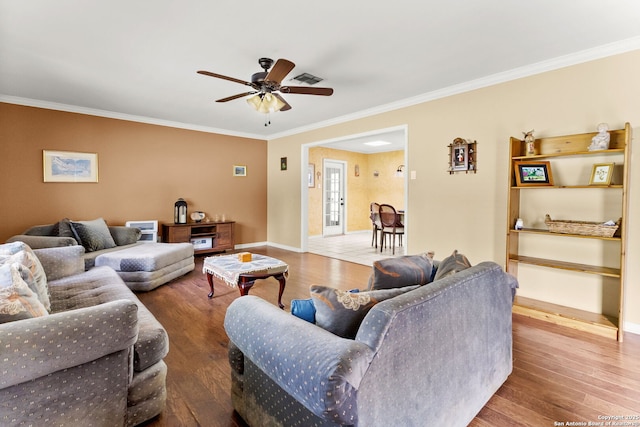 114 Nueces, Seguin, TX 78155 - living room featuring visible vents, ceiling fan, baseboards, ornamental molding, and wood finished floors